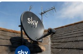Satellite dish on tiled roof